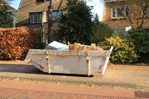 Sofa being carefully lifted by removalists